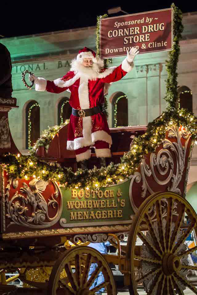 Santa Claus greeting crowd at holiday parade