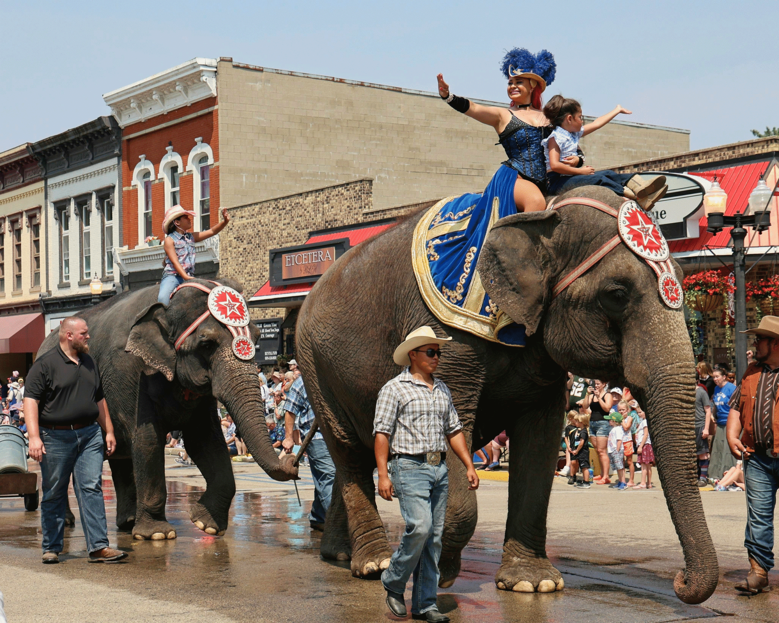 Circus World Cast Members Ride Elephants In Parade